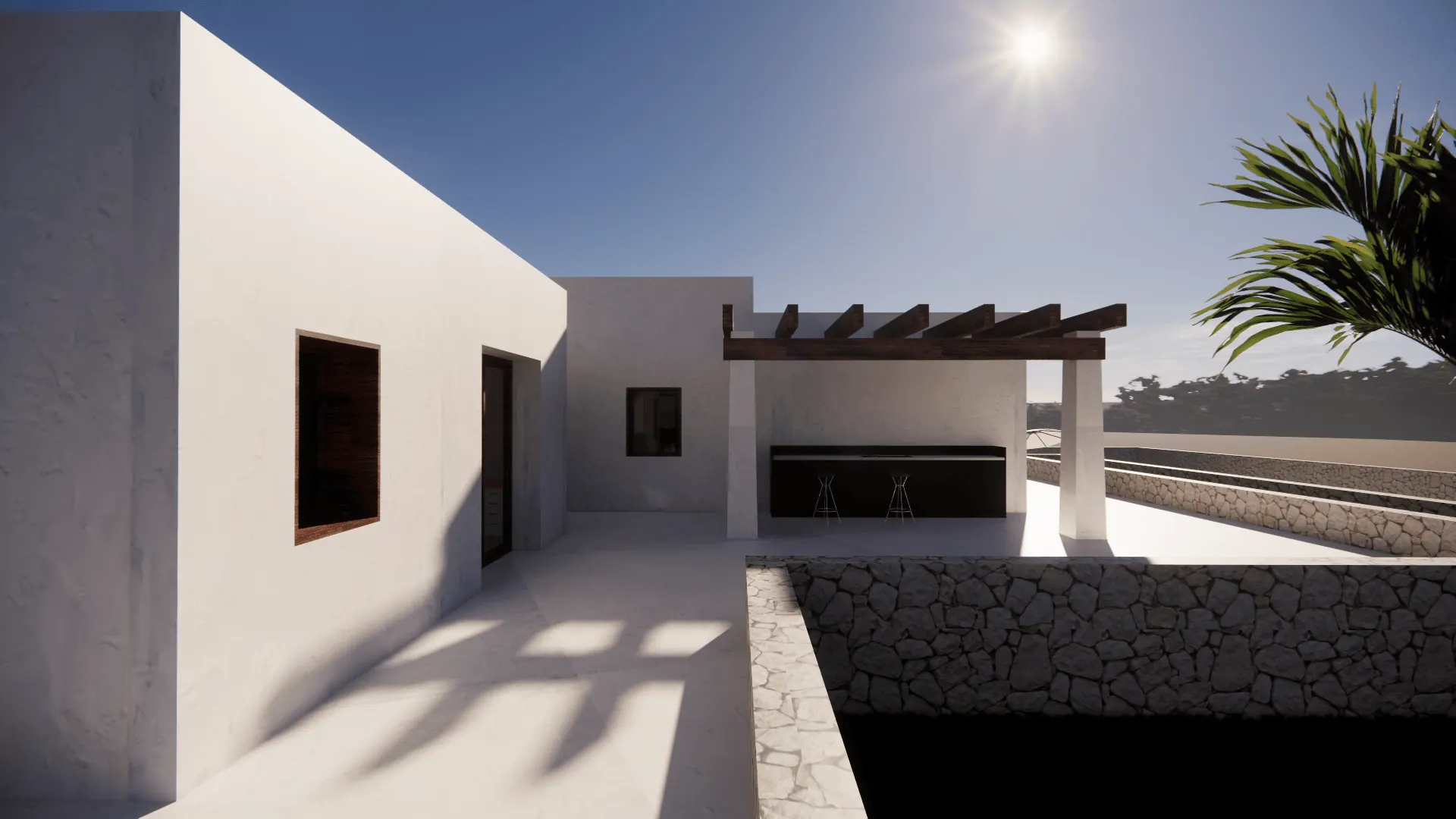 El patio de la cocina exterior, con la barra bajo la pérgola de vigas de madera y el muro de mampostería cerrando el recinto. La lámina de agua queda medio nivel por debajo.